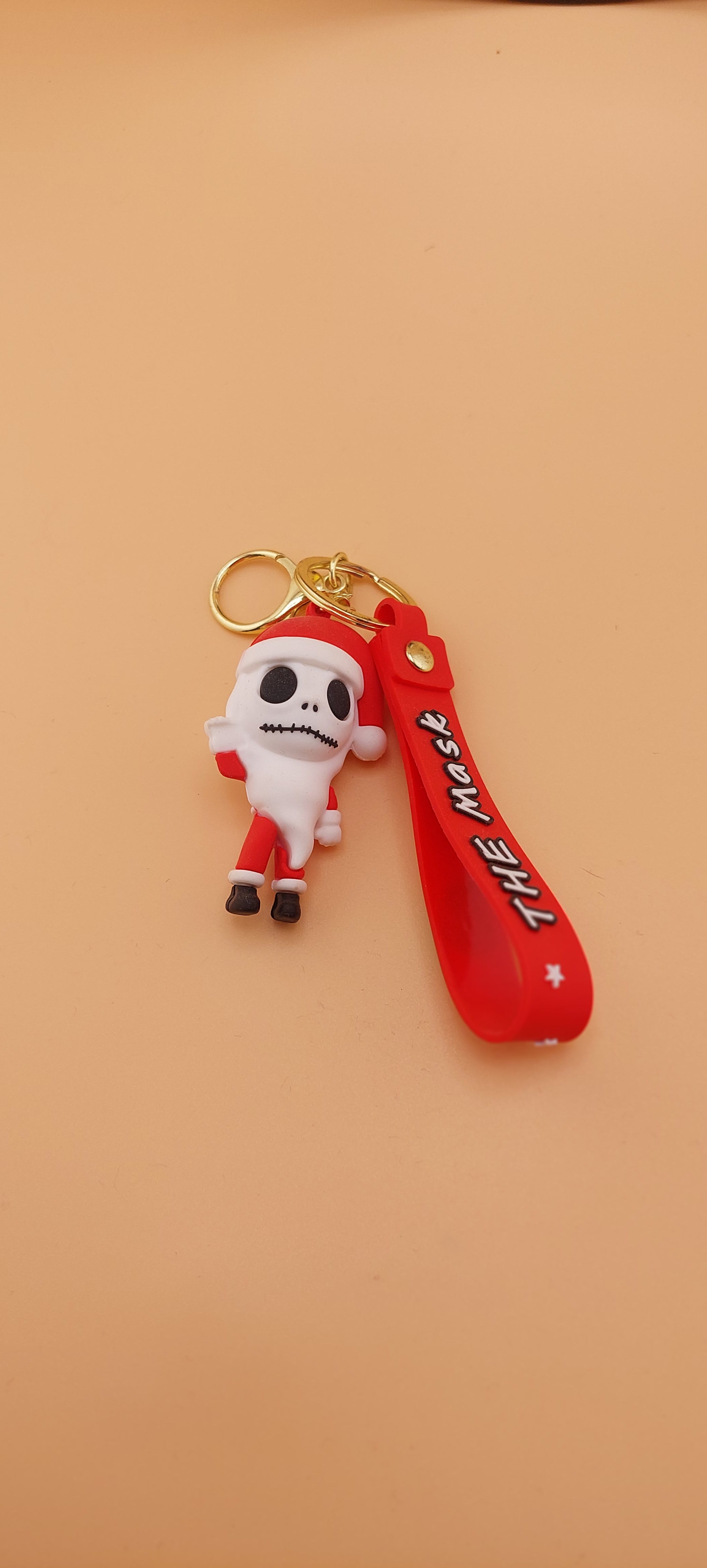 A keychain featuring an animated character from 'The Nightmare Before Christmas' attached to a brown strap with the text 'DEATH NOTE'.
