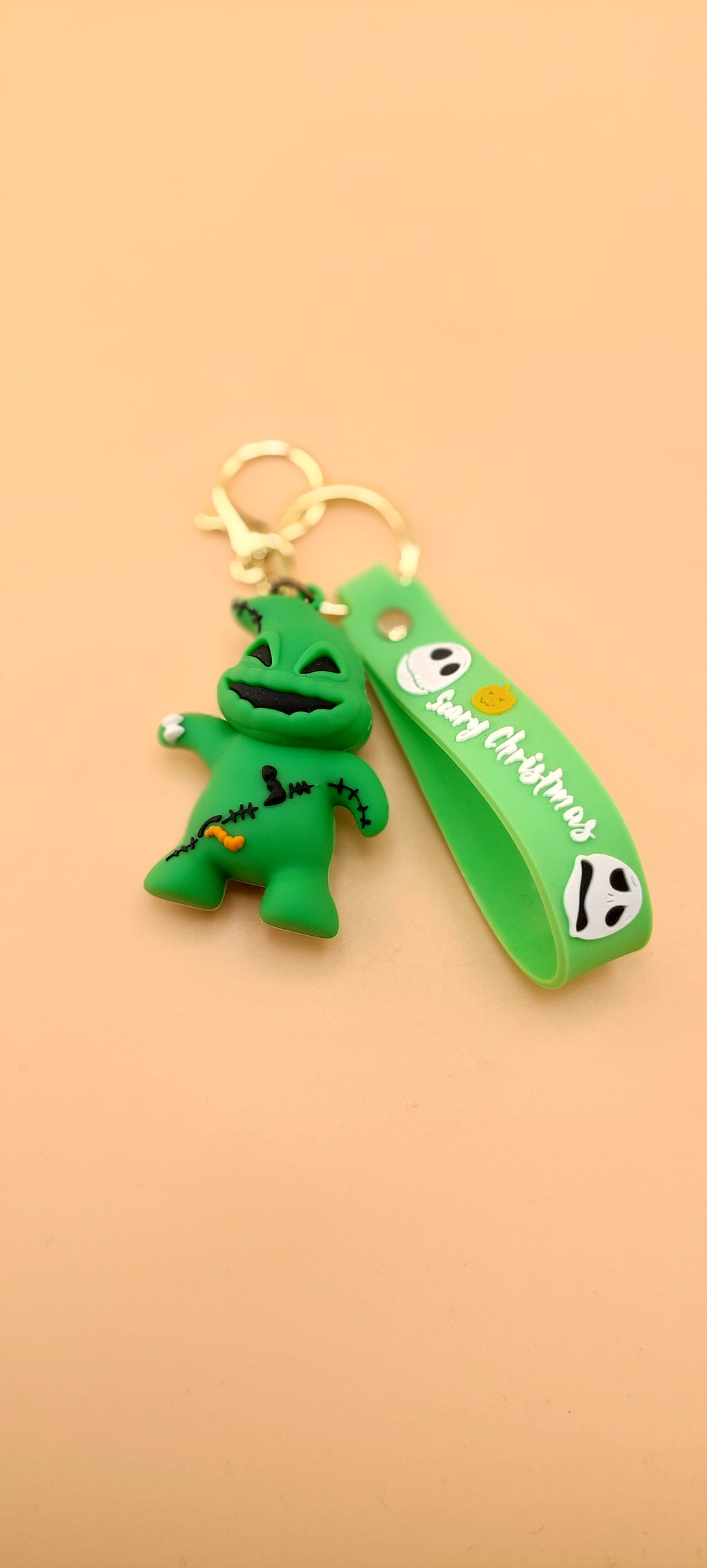 A keychain featuring an animated character from 'The Nightmare Before Christmas' attached to a brown strap with the text 'DEATH NOTE'.