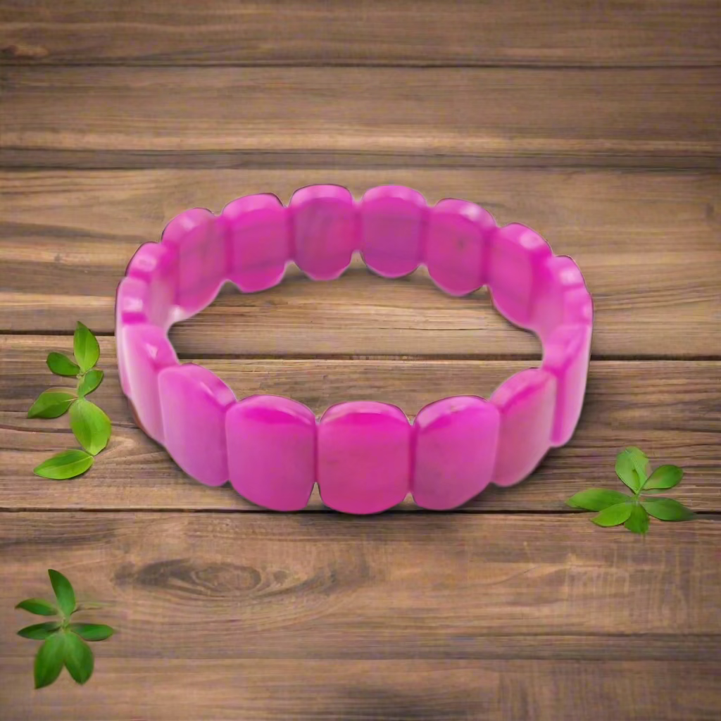 Pink beaded bracelet on a white background