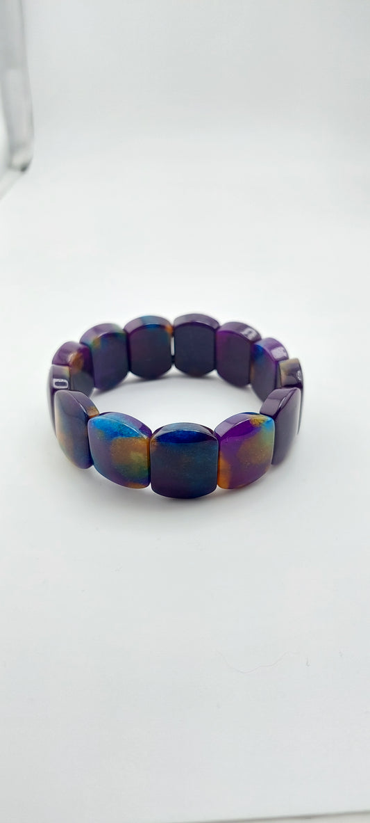 Multicolored beaded bracelet on a white background