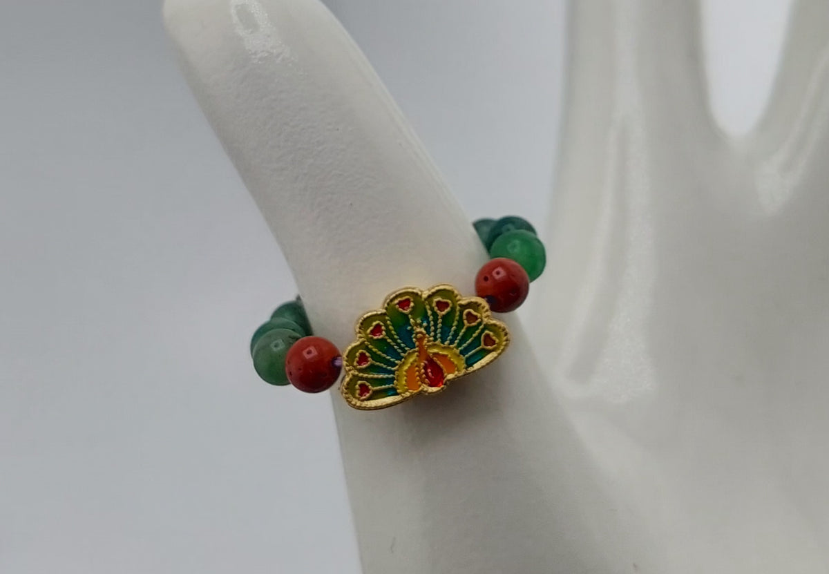 peacock ring made with healing crystal beads. created by jade couture.