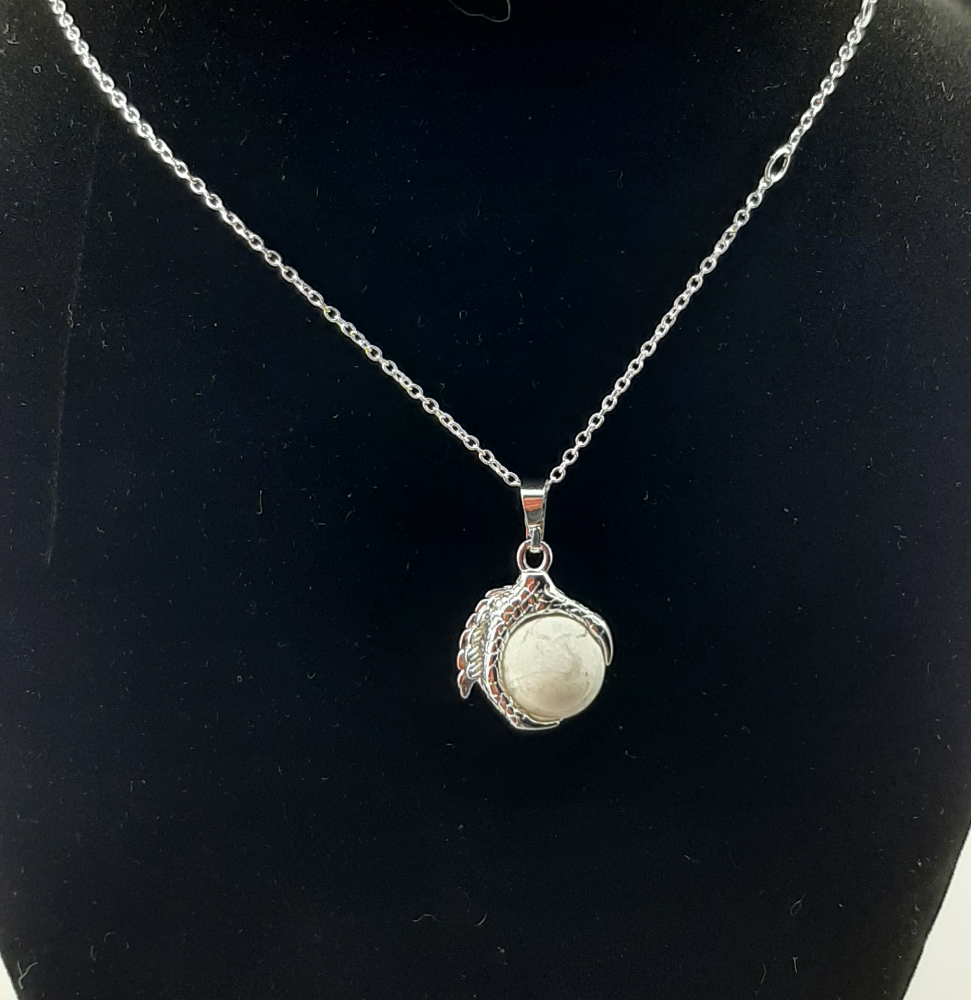 A men's necklace featuring an eagle claw pendant with sodalite stone set in silver, displayed against a black background with a leather-like choker.