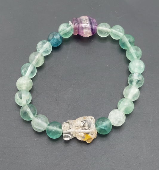 A Hello Kitty themed fluorite bracelet with multicolored beads and a character charm.