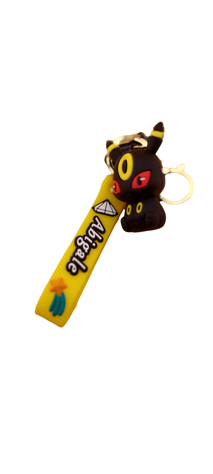 A blue keychain featuring an animated character similar to Evee from the Pokemon franchise, displayed against a neutral background.