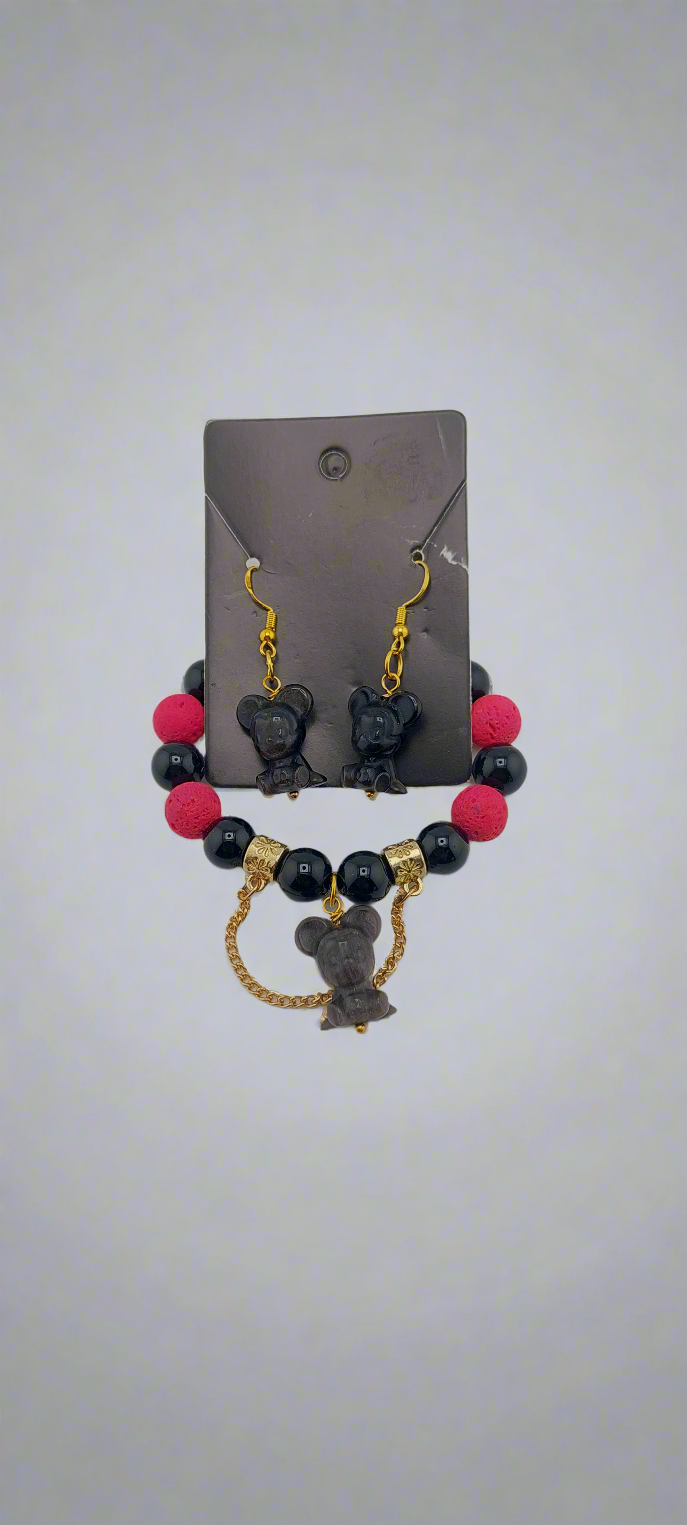 A set of Mickey Mouse themed jewelry including a bracelet and earrings with black, red, and gold colors.