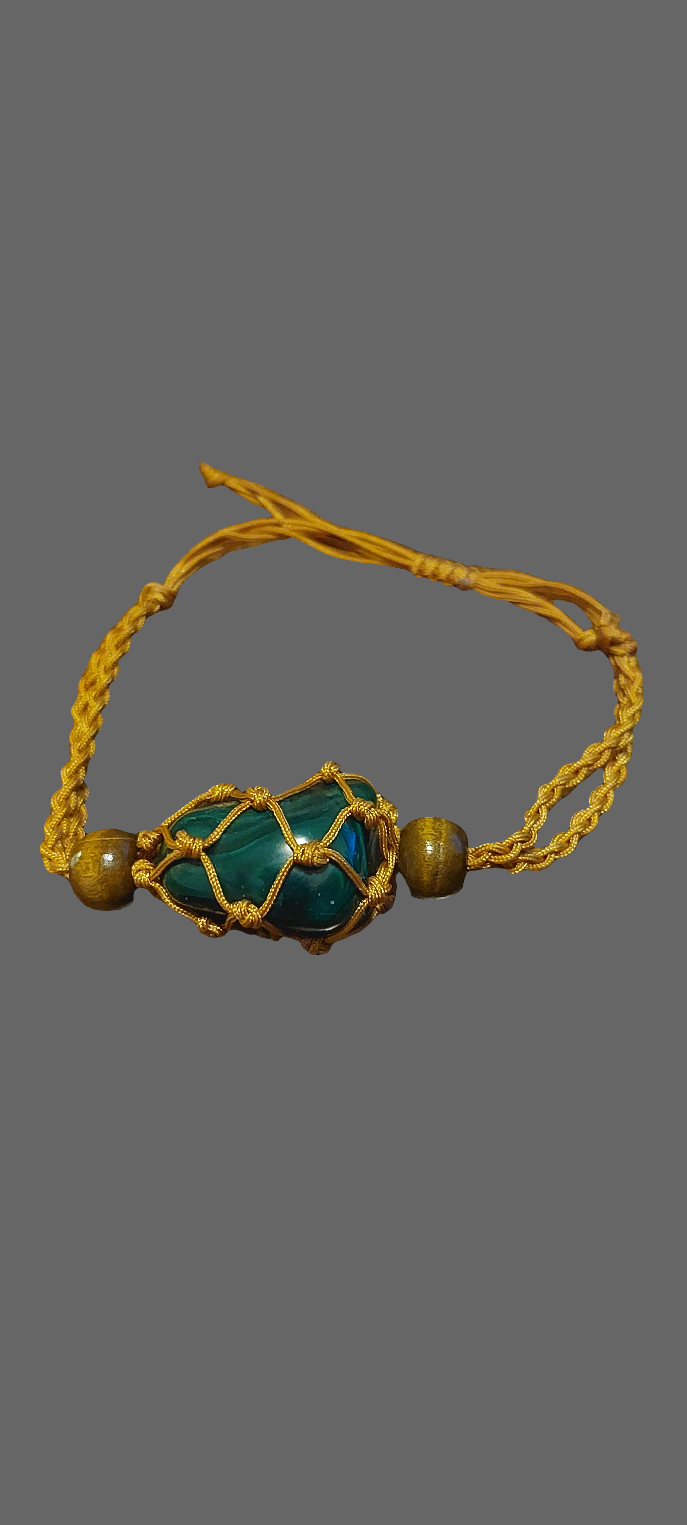 A coffee Macrame tumbled stone bracelet displayed against a grey background.