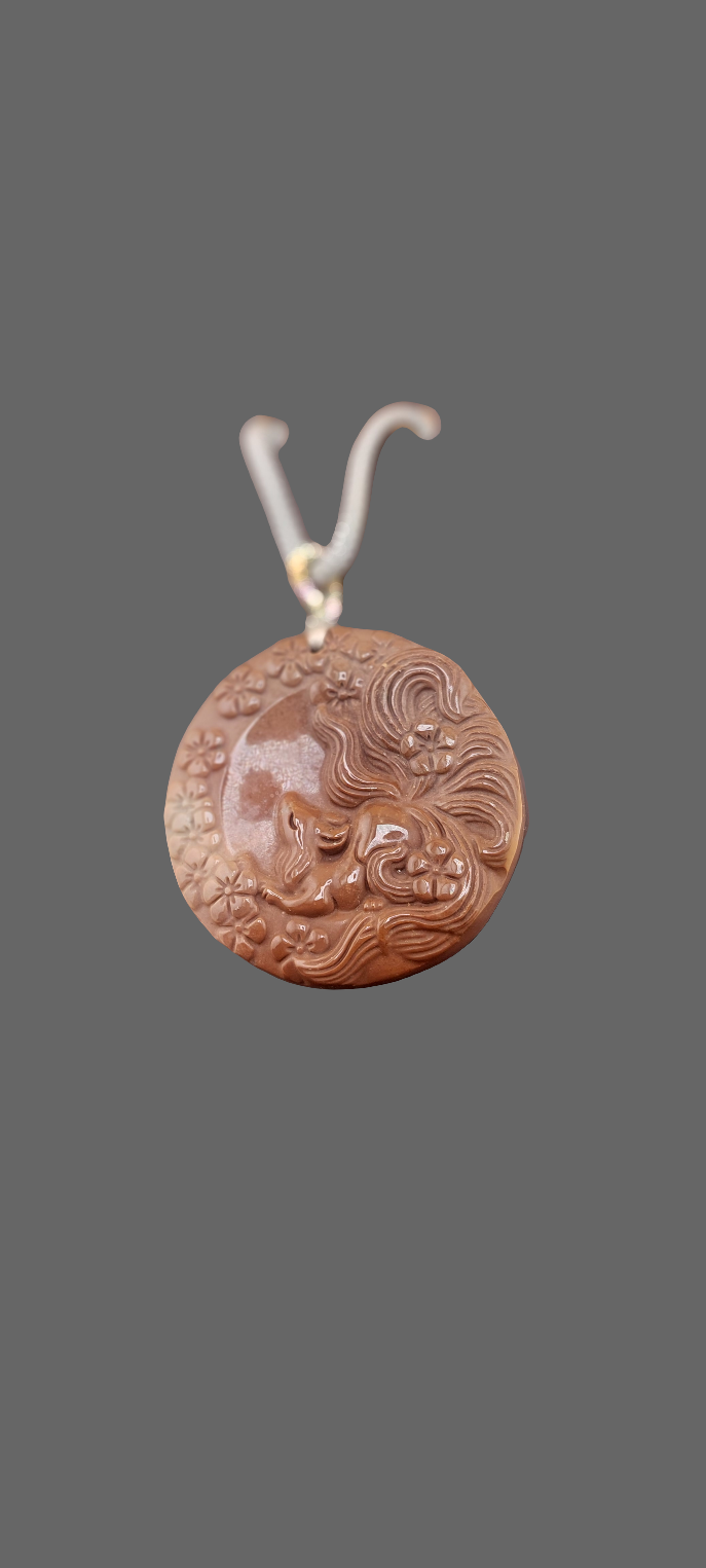 A detailed image of a copper-colored Alashan nine tails fox necklace against a neutral background.