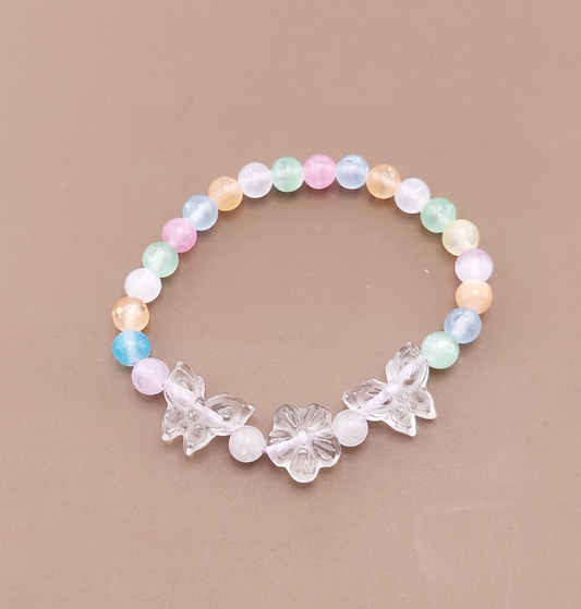 A bracelet with multicolored beads and clear butterfly-shaped crystal embellishments