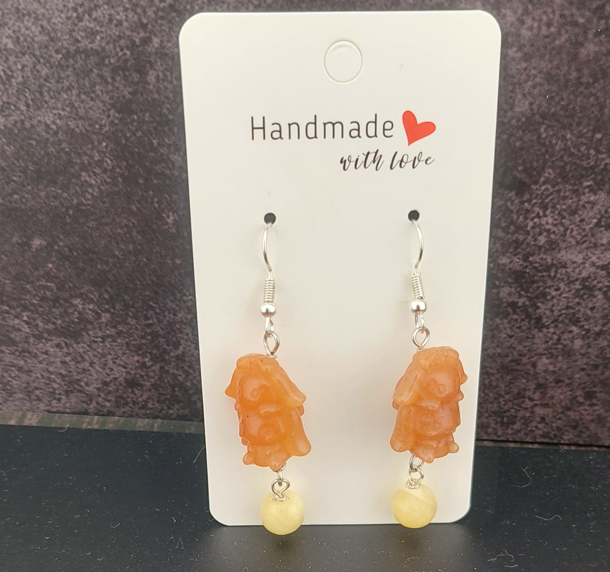 Handmade earrings on a card with 'Handmade with Love, orange calcite stone