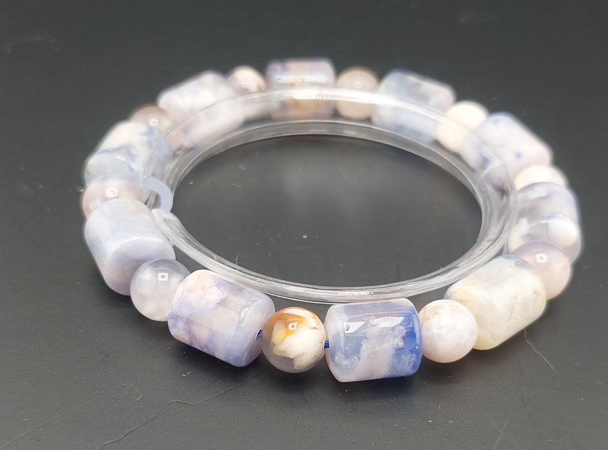 Beaded bracelet with multicolored stones on a dark background