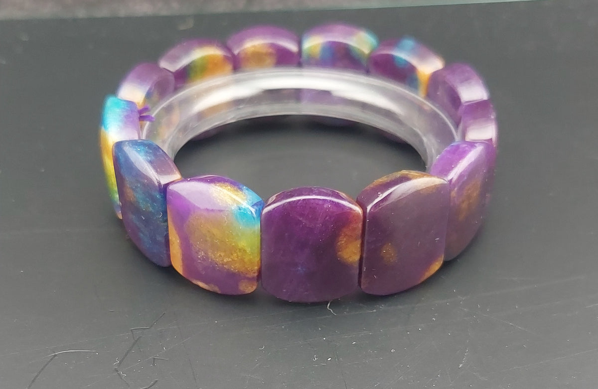 Multicolored bracelet on a dark surface