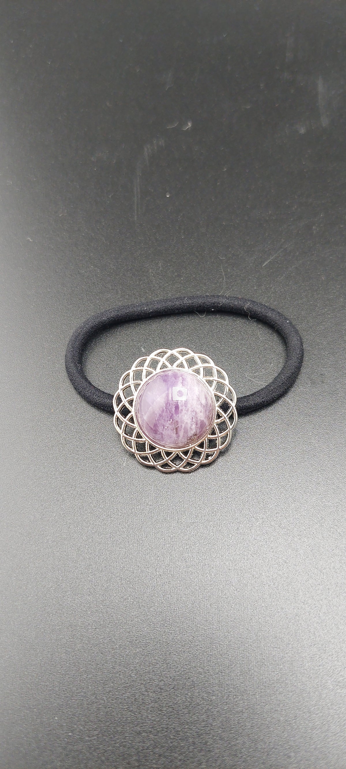 Silver hair ties with healing stone accent.