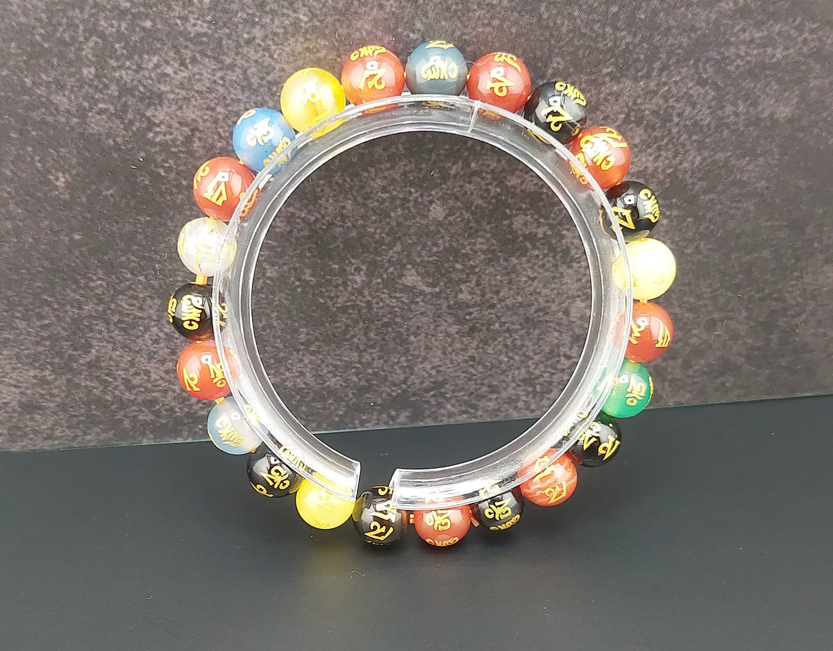 Multicolored beaded bracelet on a dark surface