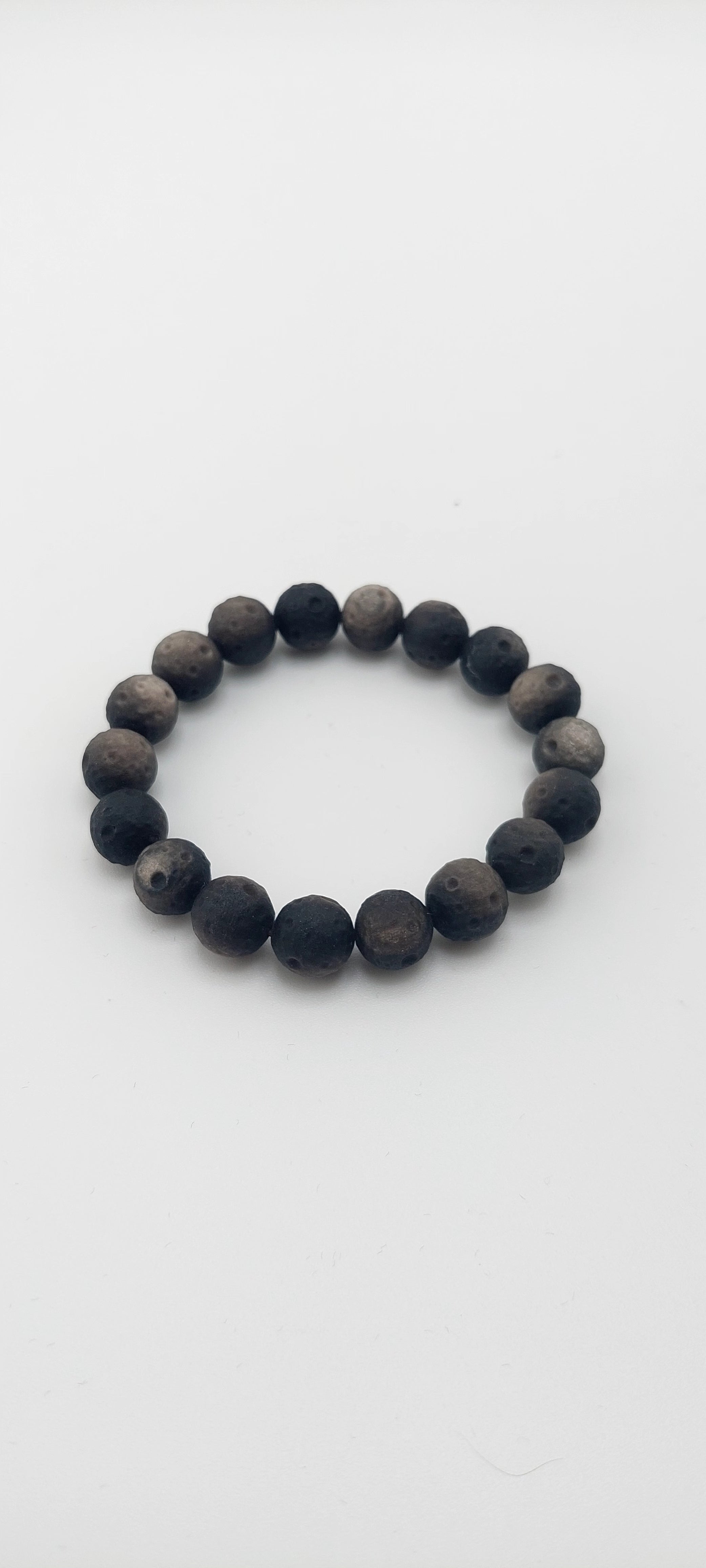 Black beaded bracelet on a white background