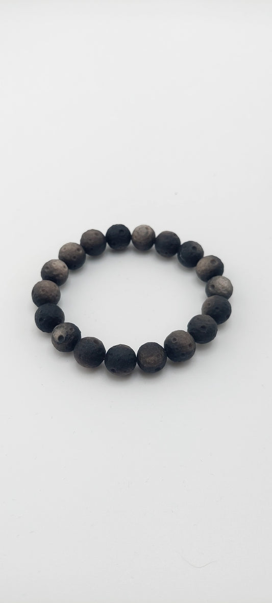 Black beaded bracelet on a white background